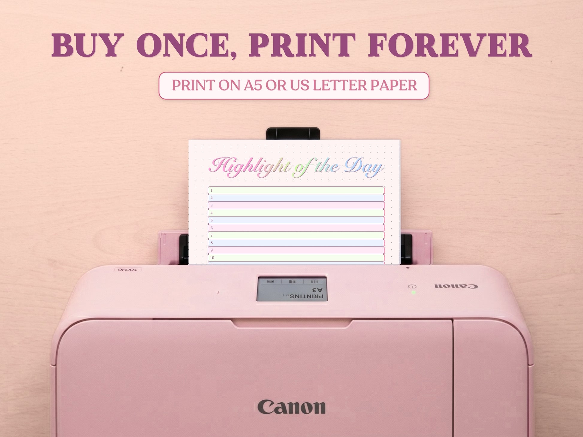 A printable 'Highlight of the Day' tracker page being printed from a pastel pink Canon printer on a light wood desk setup. The image template includes large decorative text overlays saying 'BUY ONCE, PRINT FOREVER' and 'PRINT ON A5 OR US LETTER PAPER' to highlight its printable features for a bullet journal.