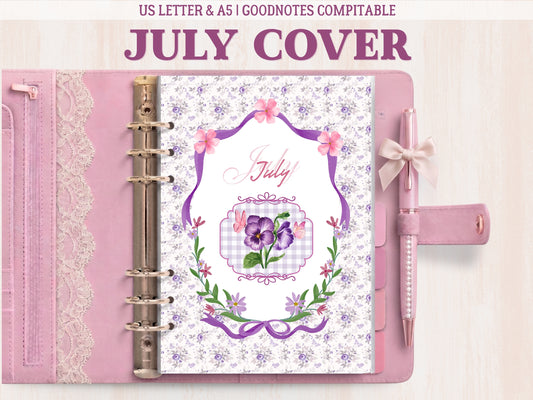 A bullet journal cover page for July displayed inside a light pink leather binder with lace details and a matching bow pen. Features an elegant illustration of purple pansies and butterflies inside a frame, surrounded by an intricate purple floral pattern. Labeled as GoodNotes compatible.