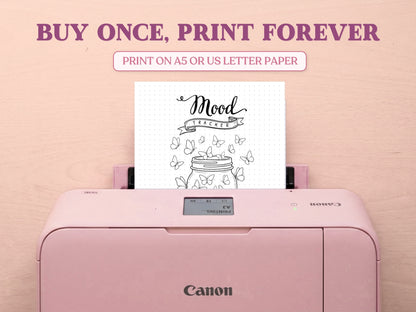 A printable minimalist butterfly jar mood tracker page being printed from a pastel pink Canon printer on a light wood desk setup. The image template includes large decorative text saying 'BUY ONCE, PRINT FOREVER' and 'PRINT ON A5 OR US LETTER PAPER' to highlight its printable features for a bullet journal.