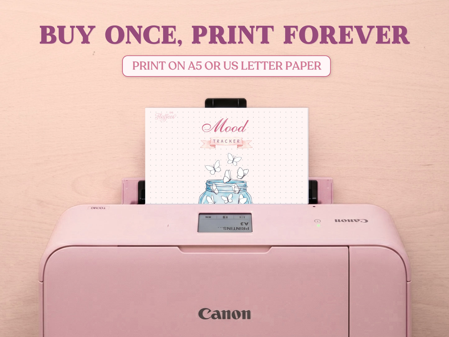 A printable butterfly jar mood tracker page being printed out of a pastel pink Canon printer on a wooden desk. Features large promotional text reading 'BUY ONCE, PRINT FOREVER' and 'PRINT ON A5 OR US LETTER PAPER' to emphasize it is a printable bullet journal template.