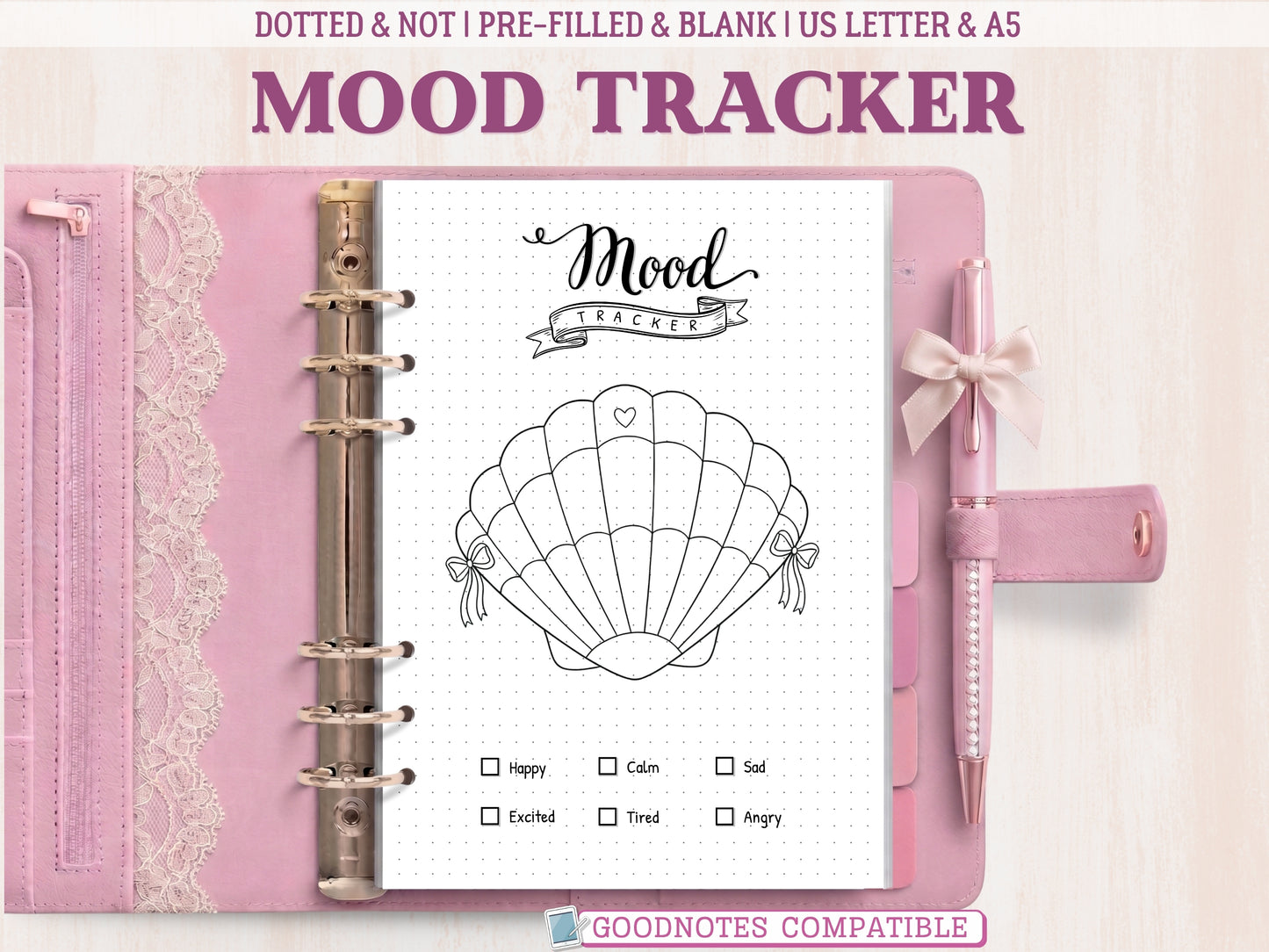 A minimalist seashell mood tracker page for a bullet journal displayed inside an open pink leather binder decorated with lace. Features a black and white line-art seashell with 31 numbered sections to color and a mood key at the bottom. Labeled as GoodNotes compatible.