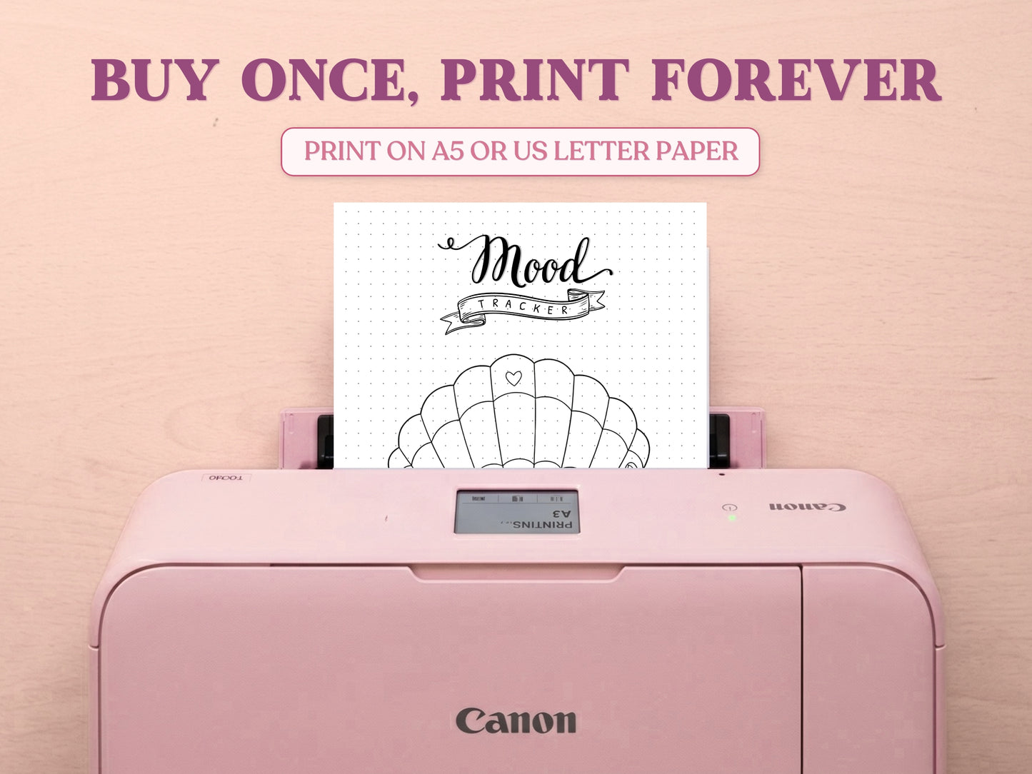 A printable minimalist seashell mood tracker page being printed from a pastel pink Canon printer on a light wood desk setup. The image layout includes large decorative text saying 'BUY ONCE, PRINT FOREVER' and 'PRINT ON A5 OR US LETTER PAPER' to highlight its printable features for a bullet journal.