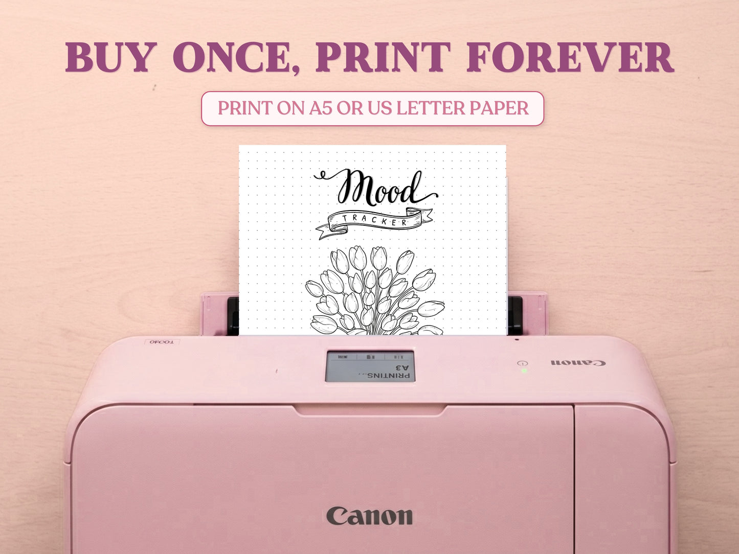 A printable tulip bouquet mood tracker page being printed from a pastel pink Canon printer on a light wood desk setup. The image layout includes large decorative text saying 'BUY ONCE, PRINT FOREVER' and 'PRINT ON A5 OR US LETTER PAPER' to highlight its printable features for a bullet journal.