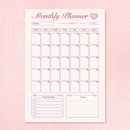 Monthly planner with calendar and notes section on a pink background