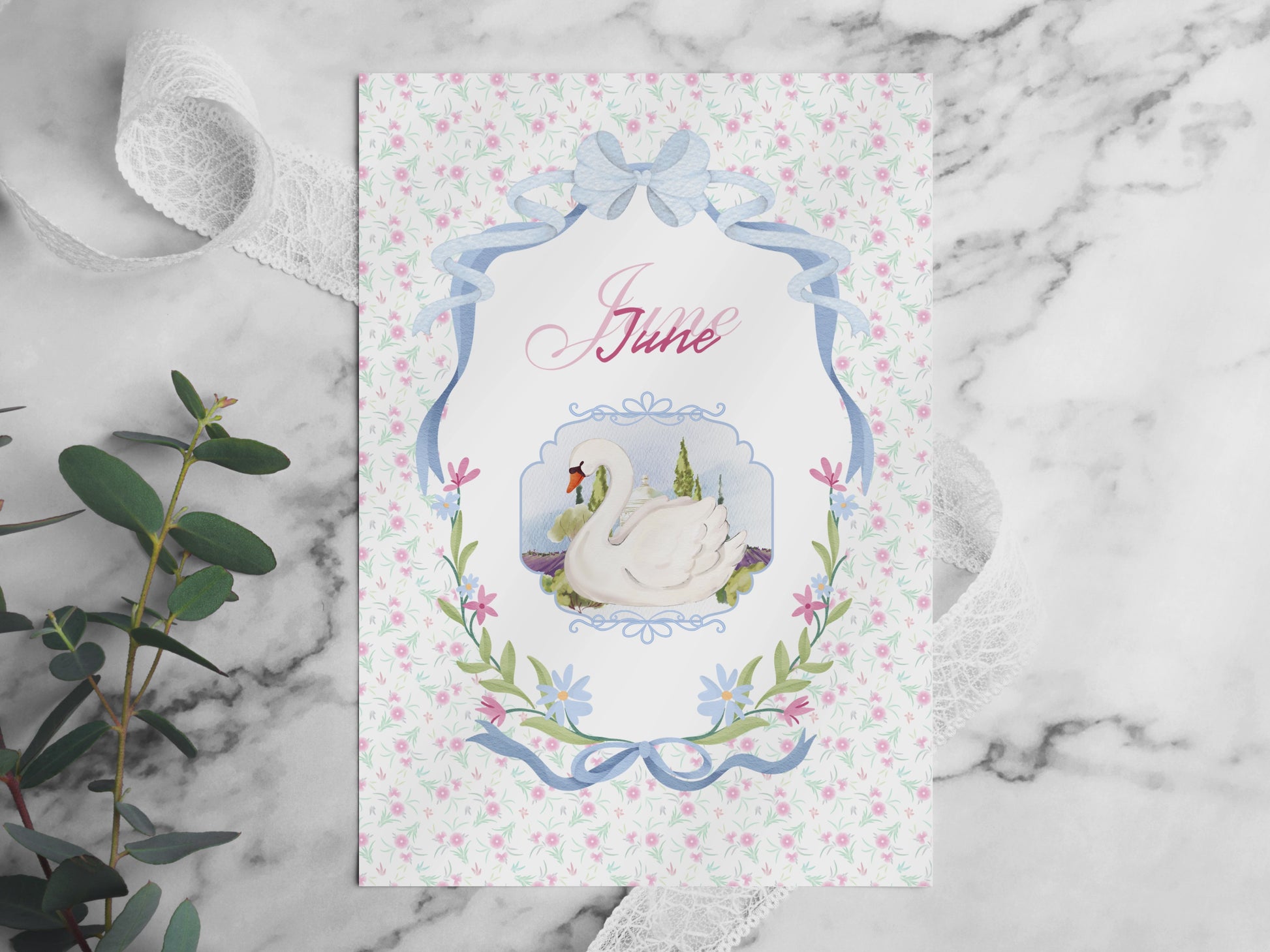 A video flip-through of the June Bullet Journal pages placed on a white marble table. The video showcases various layouts including the swan cover, habit trackers, and workout challenges in a soft pink aesthetic. Surrounded by decorative elements like eucalyptus, lace, and pearls in bright, natural light.